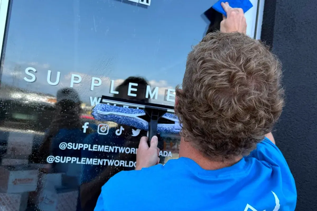 Professional window cleaning technique demonstration